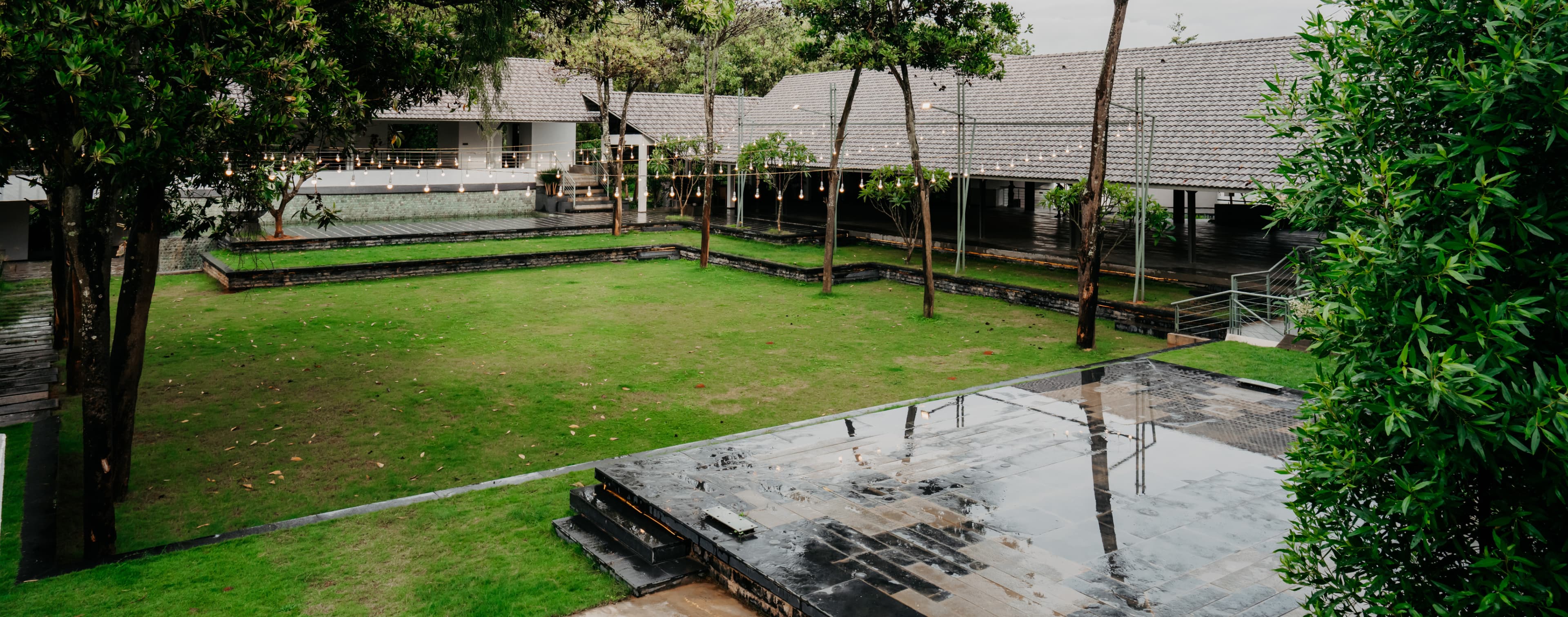 Luxury wedding venue in Bangalore with open lawn and Balinese-inspired design